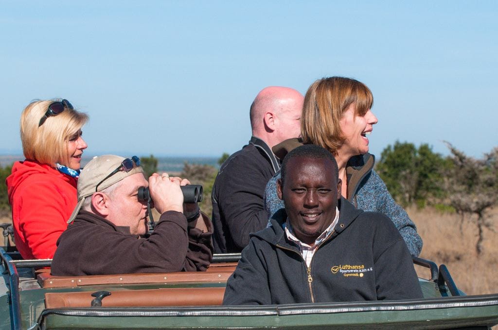About 1 Luxury safari traveler planning itinerary with private guide